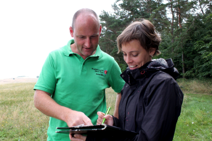 Ranger Daniel Witt interviewing a tourist 