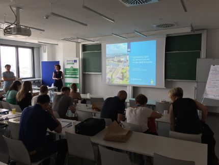 Gwenda Zuurbier holding a lecture  A Dutch collaborative programme between the authority and company to reduce the peak of commuter traffic 