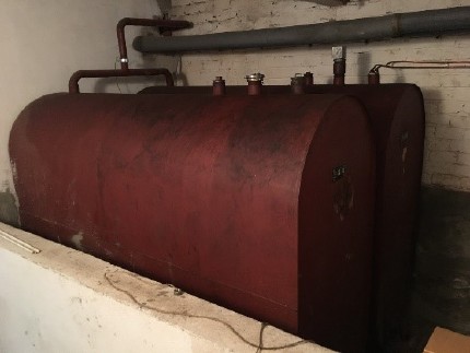 inefficient old heating oil boiler and the heating oil storage tank inefficient old heating oil boiler and the heating oil storage tank