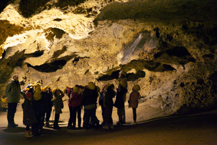 Tourists visiting cave Tourists visiting cave